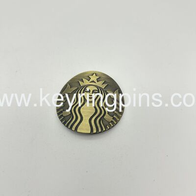 Customized Starbucks Mermaid Logo Metal Commemorative Badge / Coin,The overall color is antique bronze and it is in an oval shape.