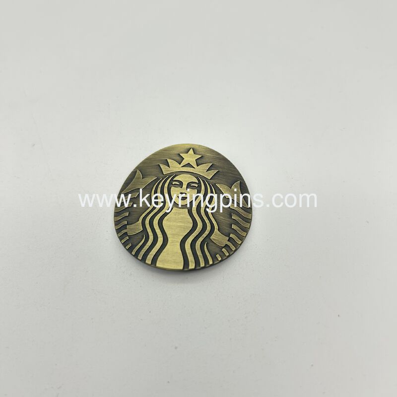 Customized Starbucks Mermaid Logo Metal Commemorative Badge / Coin,The overall color is antique bronze and it is in an oval shape.